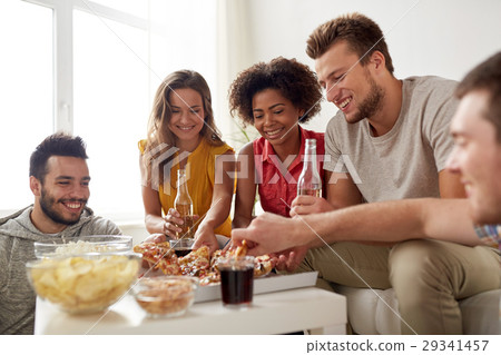 happy friends with drinks eating pizza at home happy friends with drinks eating pizza at home 29341457
