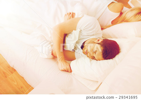 couple sleeping in bed at home 29341695