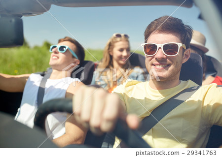 happy friends driving in cabriolet car 29341763