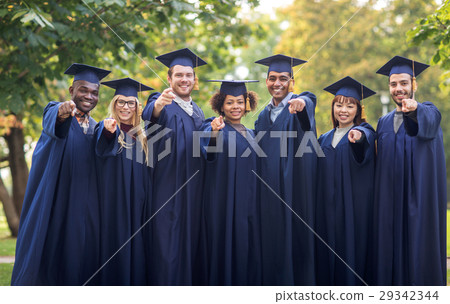 happy students or bachelors pointing finger at you happy students or bachelors pointing finger at you 29342344