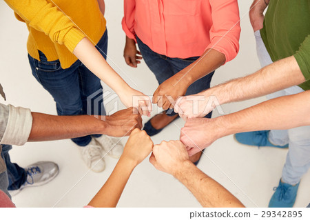 hands of international people making fist bump 29342895