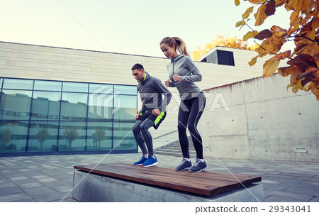 man and woman exercising on bench outdoors 29343041