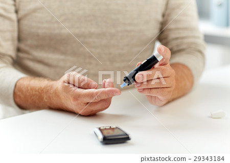 close up of old man with glucometer blood test close up of old man with glucometer blood test 29343184