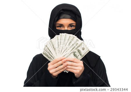 muslim woman in hijab with money over white 29343344