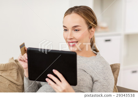 happy woman with tablet pc and credit card happy woman with tablet pc and credit card 29343538