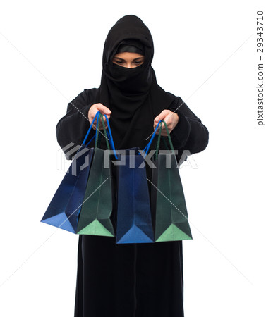 muslim woman in hijab with shopping bags 29343710