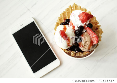 Ice cream with berry and smart phone 29343737
