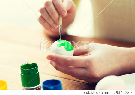 close up of woman hands coloring easter eggs close up of woman hands coloring easter eggs 29343789