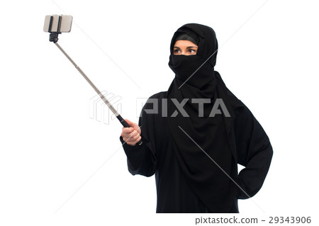 muslim woman in hijab taking selfie by smartphone 29343906