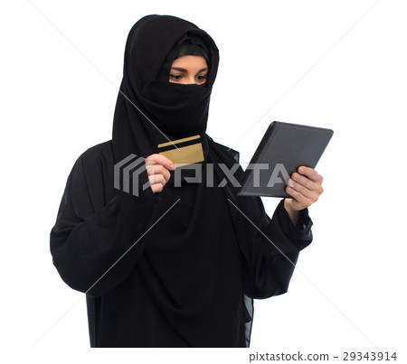 woman in hijab with tablet pc and credit card 29343914