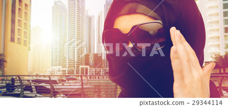 close up of muslim woman in hijab and sunglasses 29344114