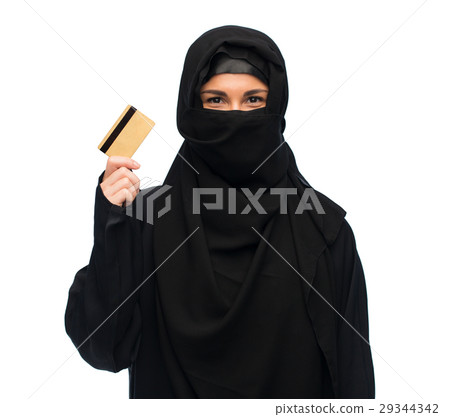 muslim woman in hijab with credit card over white muslim woman in hijab with credit card over white 29344342