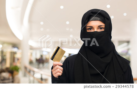 muslim woman in hijab with credit card over white muslim woman in hijab with credit card over white 29344578