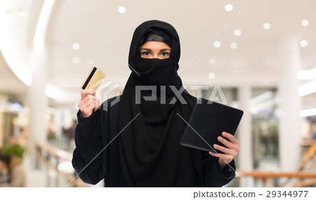 woman in hijab with tablet pc and credit card 29344977