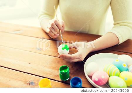 close up of woman hands coloring easter eggs close up of woman hands coloring easter eggs 29345906