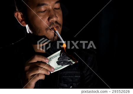 drug dealer using banknote lighting cigarette 29352026