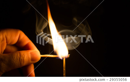 Fire match on dark blackground 29355056