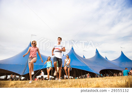 Teenagers at summer music festival in front of big Teenagers at summer music festival in front of big 29355132