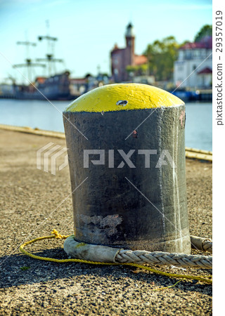 bollard in a seaport with sailing ship bollard in a seaport with sailing ship 29357019