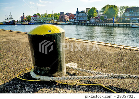 bollard in a seaport with sailing ship bollard in a seaport with sailing ship 29357023