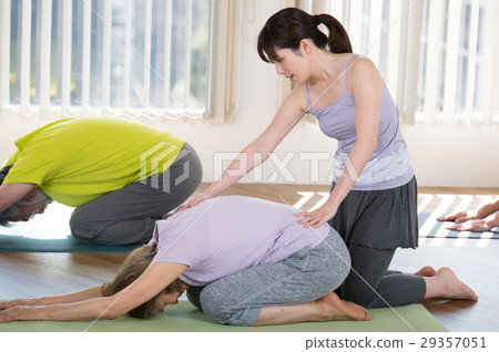 Yoga instructor and senior male and female 29357051