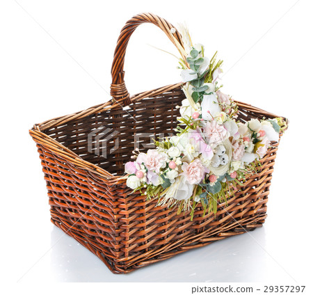 basket with flowers to celebrate Easter on a white 29357297