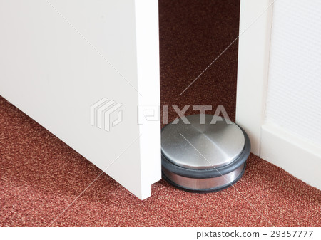 Dusty doorstop in a modern house 29357777