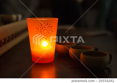 Chinese Tea cups and aromatic candle in the dark Chinese Tea cups and aromatic candle in the dark 29358262