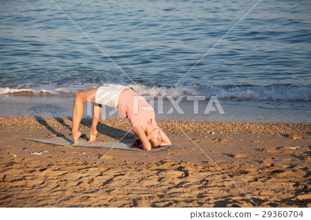 the girl is engaged in fitness and yoga the girl is engaged in fitness and yoga 29360704