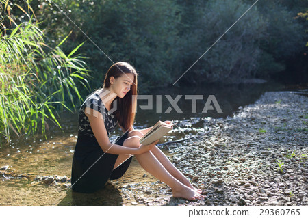 girl reading a book in the forest girl reading a book in the forest 29360765