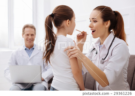 Competent intern pediatrician receiving a little 29361226