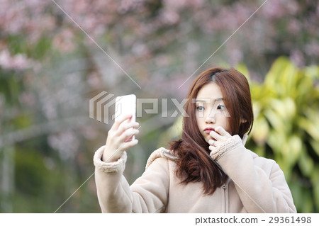 Asian woman selfie with cherry blossom sakura Asian woman selfie with cherry blossom sakura 29361498