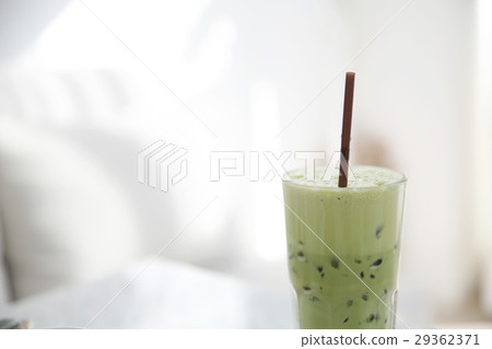 Iced green tea latte in white coffeeshop Iced green tea latte in white coffeeshop 29362371