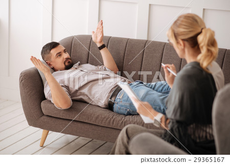 Handsome bearded man lying on the sofa Handsome bearded man lying on the sofa 29365167