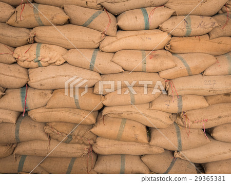 Old hemp sacks stacked in a row. 29365381