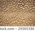 dried and cracked soil in arid season. 29365386