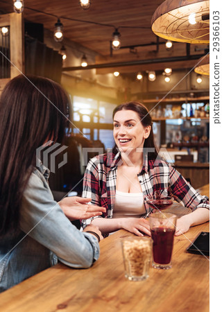 Attractive friends smiling to each other 29366103