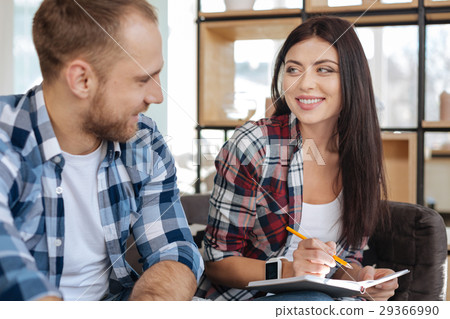 Cheerful attractive woman looking at her male Cheerful attractive woman looking at her male 29366990