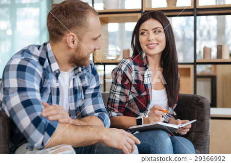 Delighted beautiful woman sitting with her male Delighted beautiful woman sitting with her male 29366992