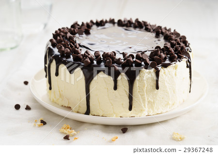 round cake with chocolate topping. 29367248