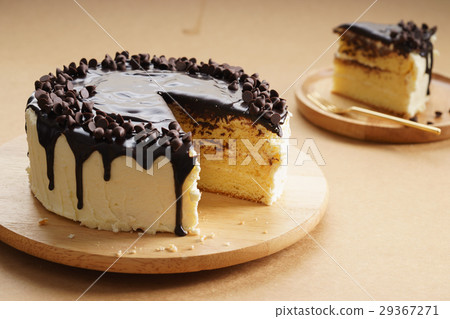 round cake with chocolate topping. 29367271