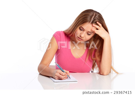 Young woman sitting behind the desk 29367415