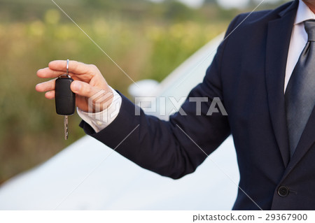 Man holding car keys Man holding car keys 29367900