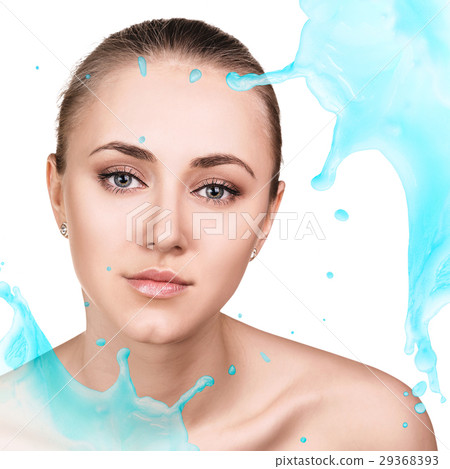 Young woman face in splashes of water. 29368393