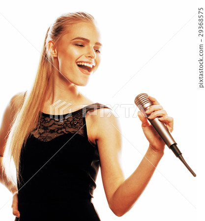 young pretty blond woman singing in microphone 29368575