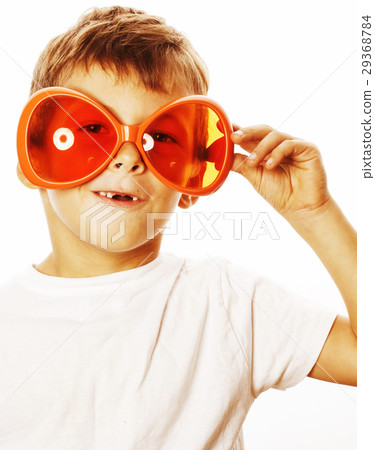 Little Cute Boy In Orange Sunglasses Pointing Stock Photo