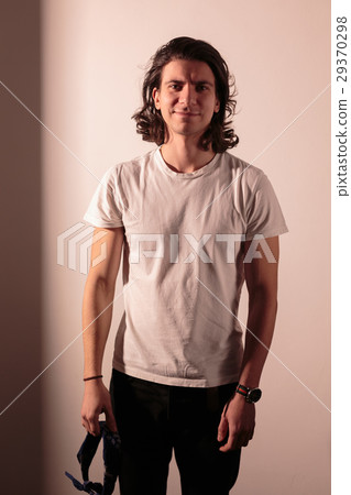 Beautiful romantic man with long hair. Beautiful romantic man with long hair. 29370298