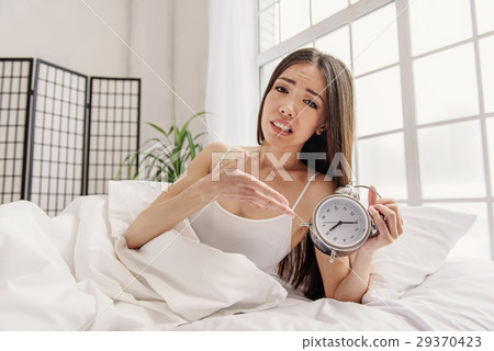 Girl expressing her disillusion in morning Girl expressing her disillusion in morning 29370423