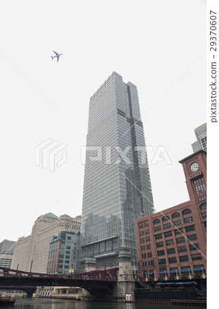 Tall mirror building locating near low Tall mirror building locating near low 29370607