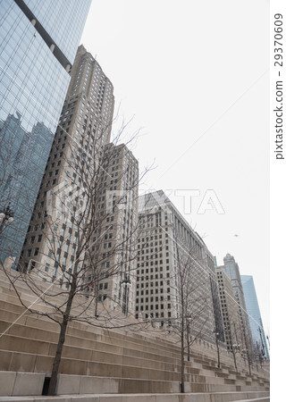 Stairs rising to tall buildings 29370609